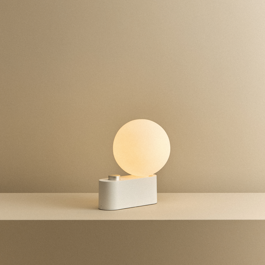 Tala Alumina Multi-Use Lamp in Chalk shown illuminated