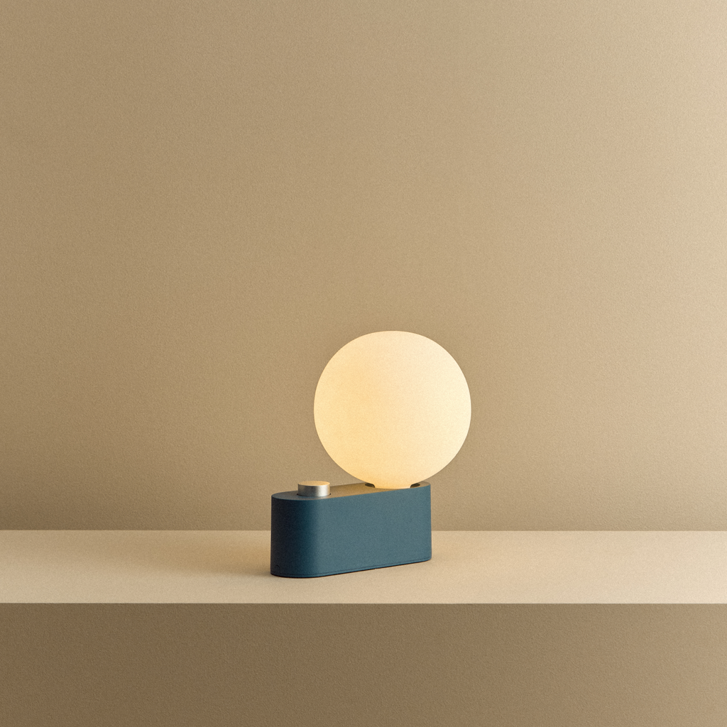 Tala Alumina Multi-Use Lamp in Sapphire shown illuminated