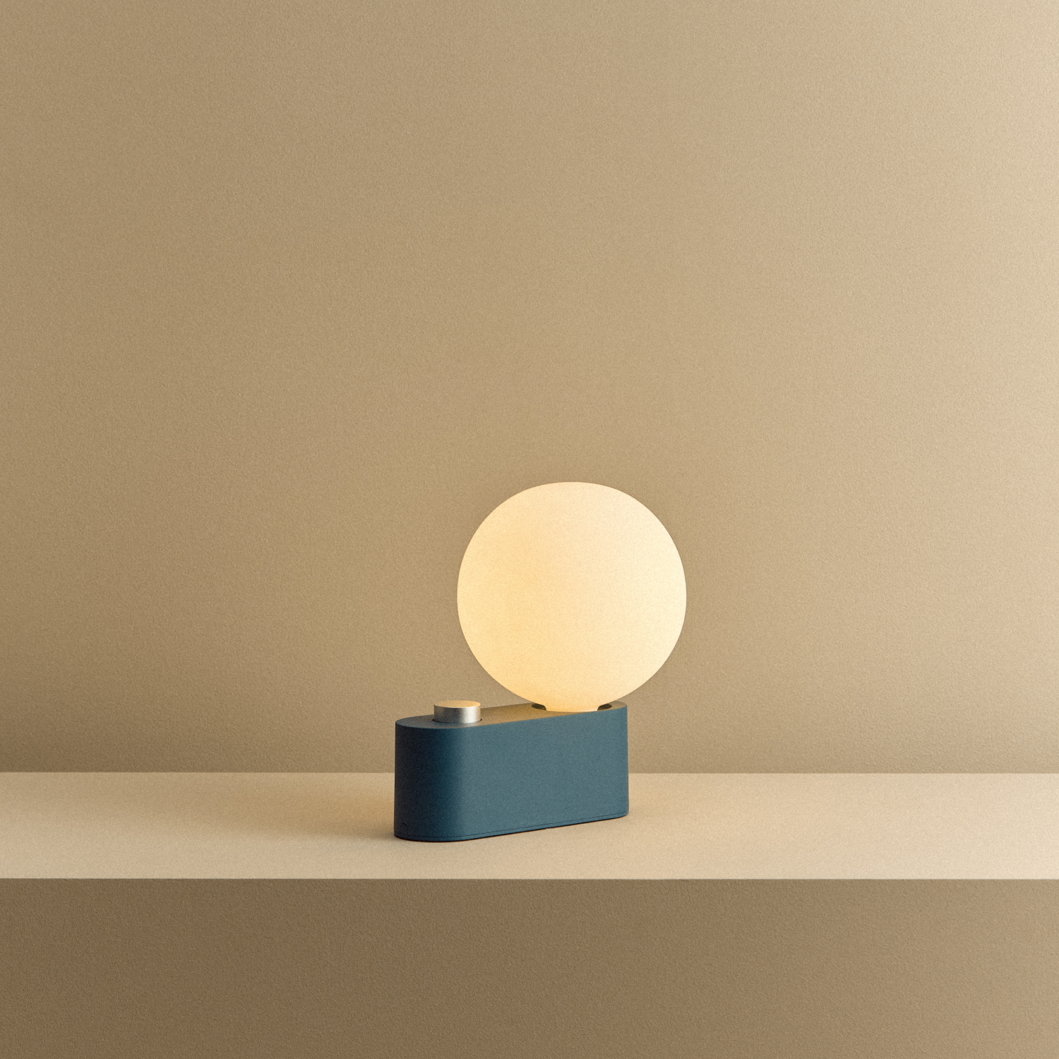 Tala Alumina Multi-Use Lamp in Sapphire shown illuminated