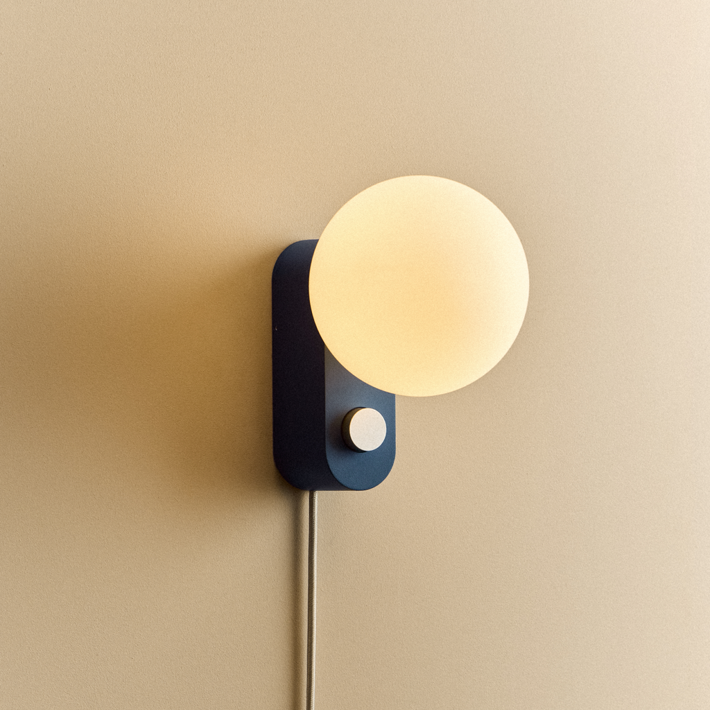 Tala Alumina Multi-Use Lamp in Sapphire shown illuminated (view 2)