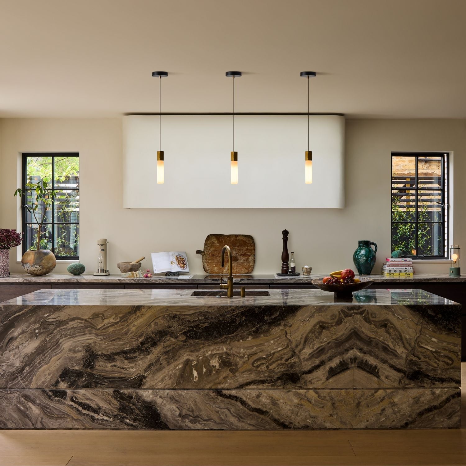 Tala Basalt Single Pendant in Brass in a styled interior setting