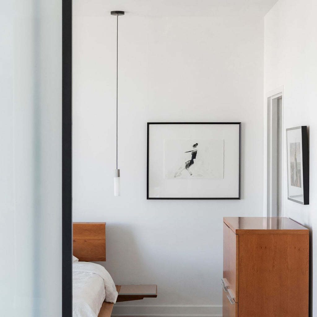 Tala Basalt Single Pendant in Stainless Steel in a styled interior setting
