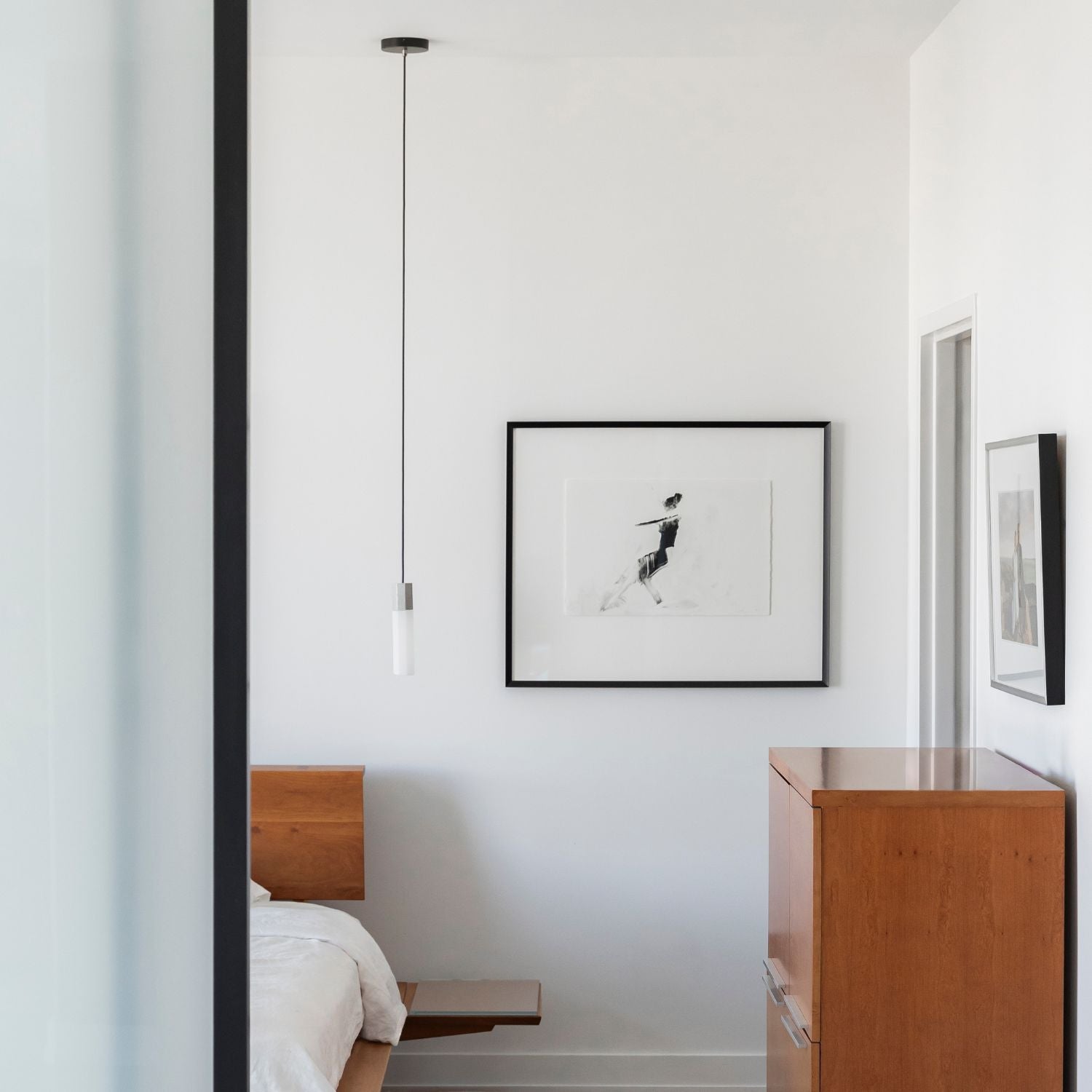 Tala Basalt Single Pendant in Stainless Steel in a styled interior setting