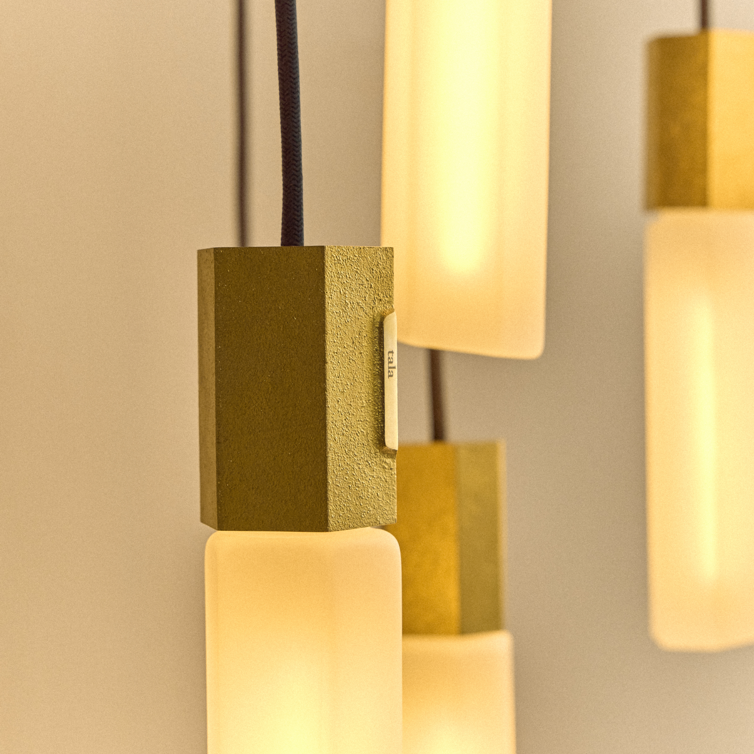 Tala Basalt Nine Pendant in Brass close-up detail of the finish (view 2)