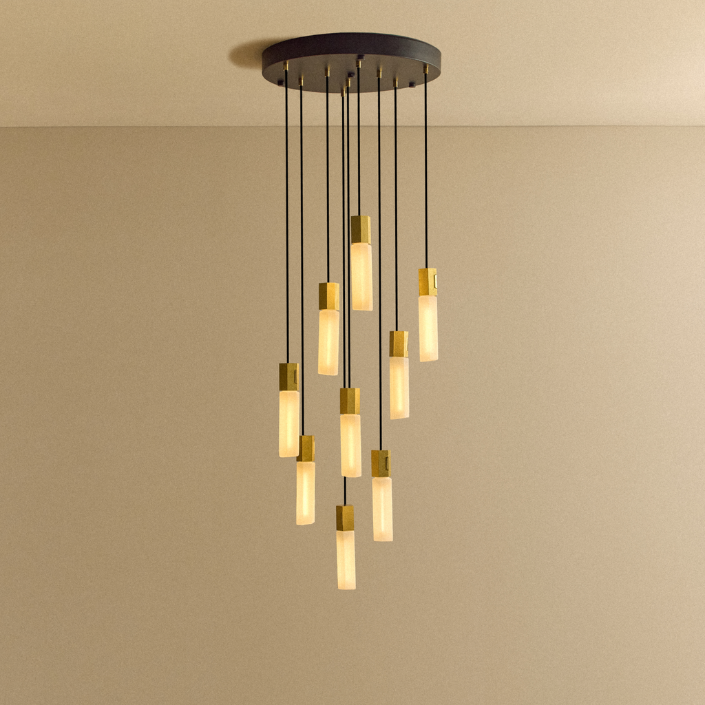 Tala Basalt Nine Pendant in Brass shown illuminated