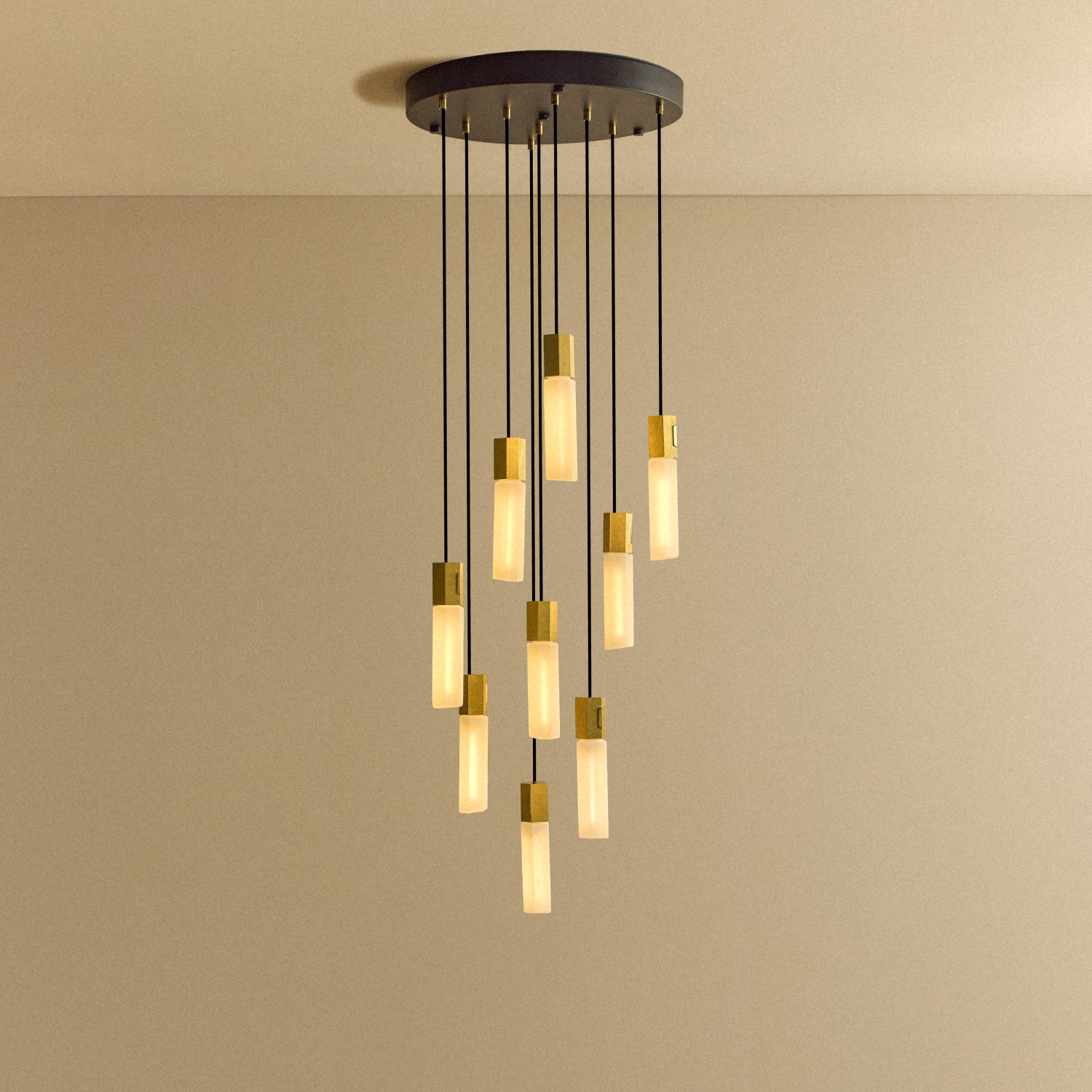 Tala Basalt Nine Pendant in Brass shown illuminated