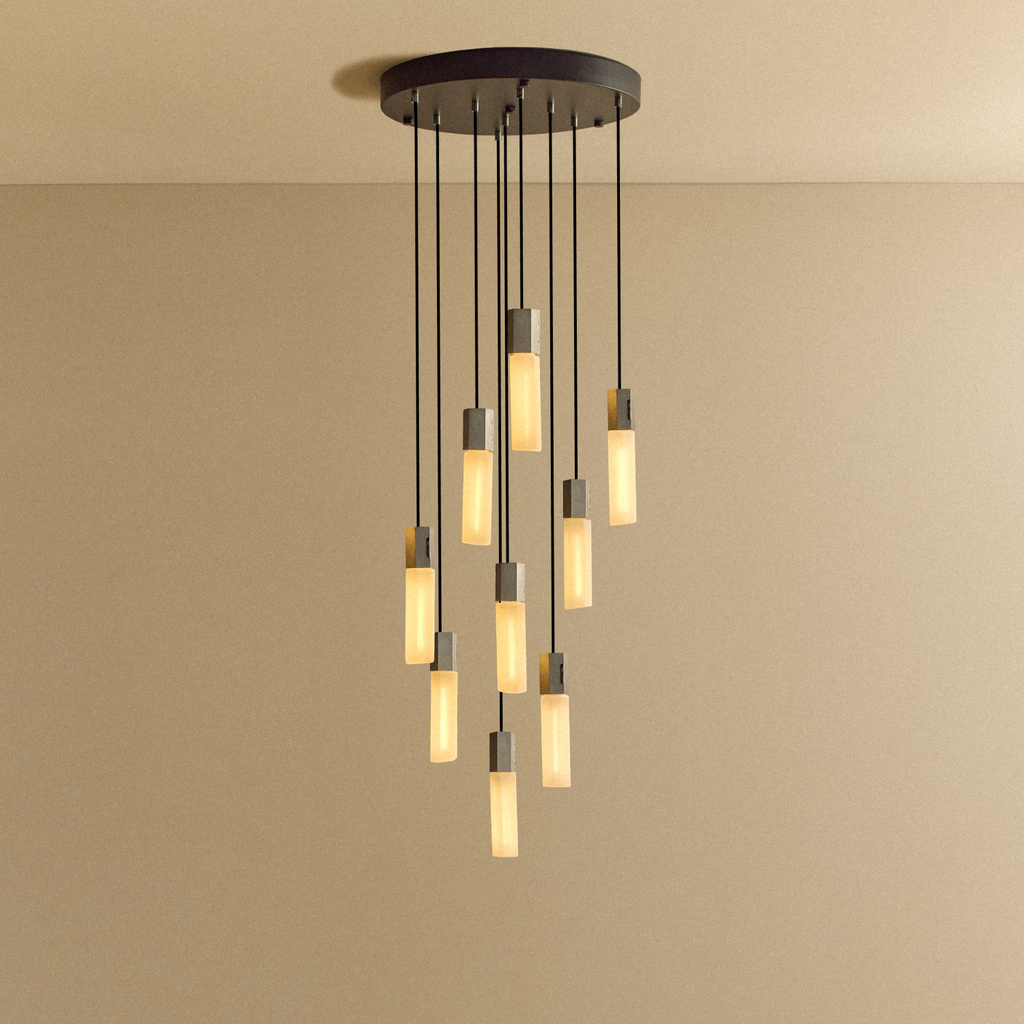 Tala Basalt Nine Pendant in Stainless Steel shown illuminated