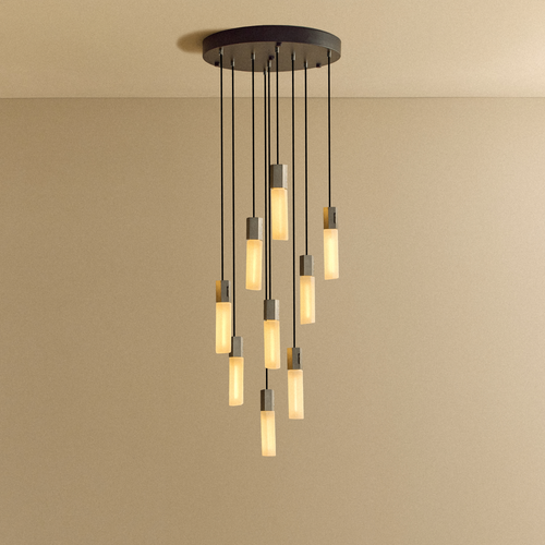 Tala Basalt Nine Pendant in Stainless Steel shown illuminated