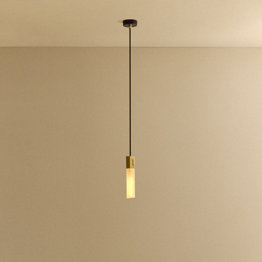 Tala Basalt Single Pendant in Brass shown illuminated