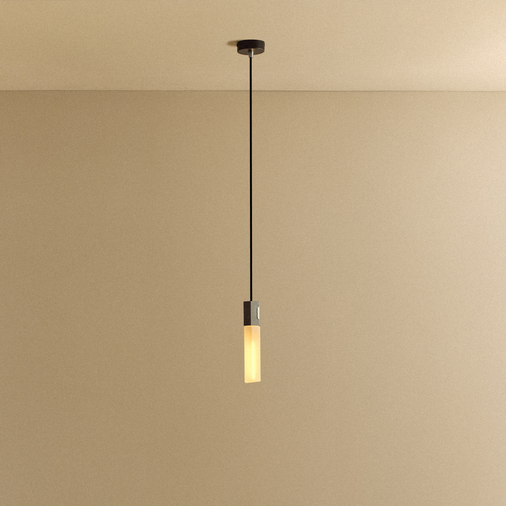 Tala Basalt Single Pendant in Stainless Steel shown illuminated