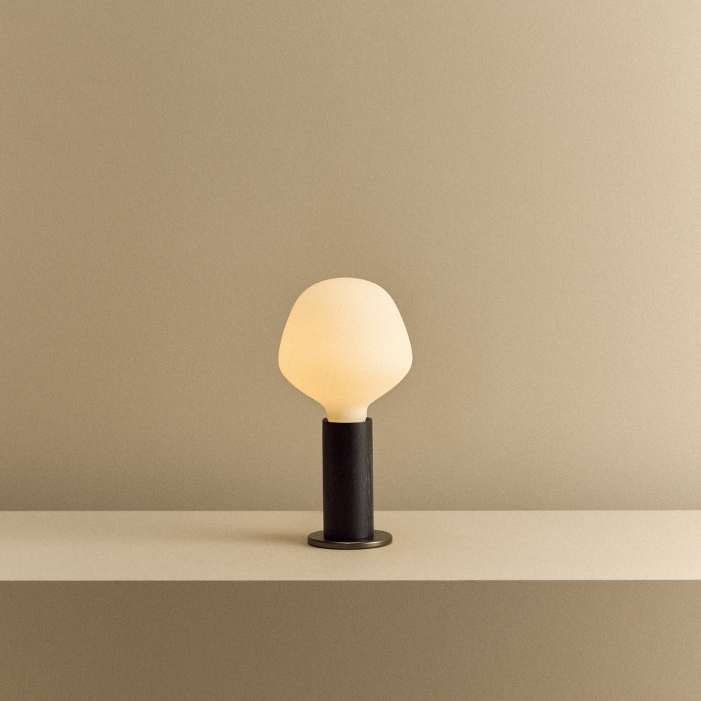 Tala Knuckle Table Lamp in Blackened Oak + Enno shown illuminated