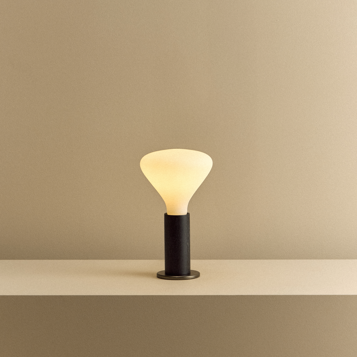 Tala Knuckle Table Lamp in Blackened Oak + Noma shown illuminated