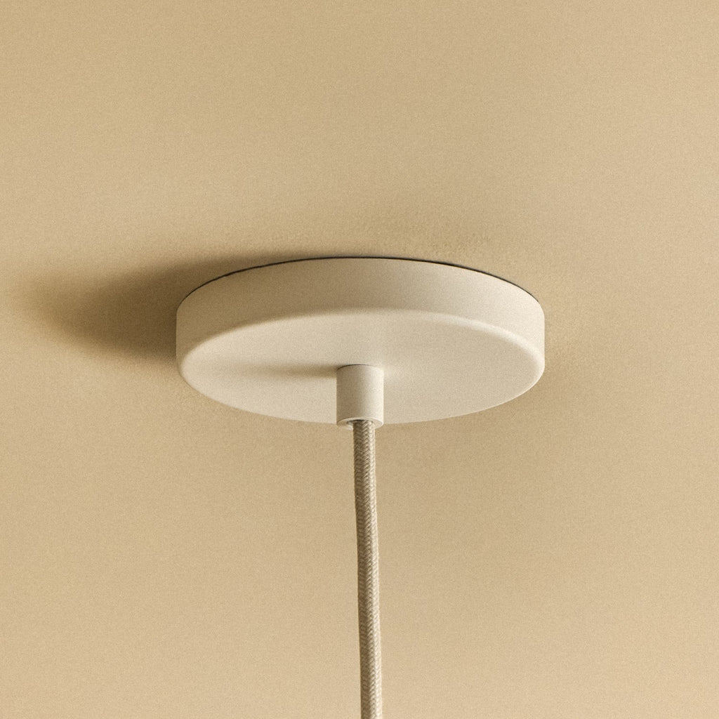 Tala Bower Pendant Light Small in Yellow + Sphere III fixture shown without a bulb