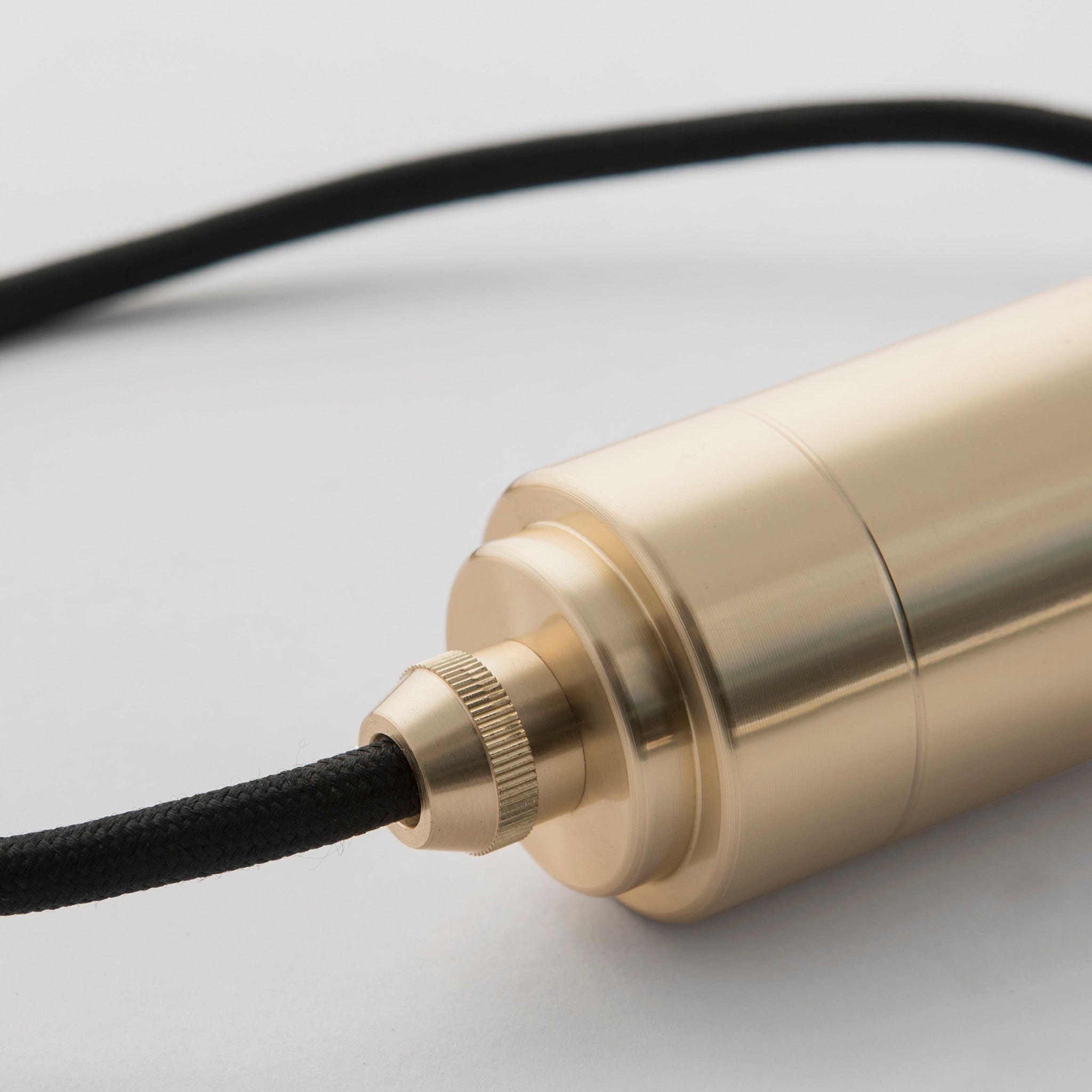 Tala Oblo Plug-In Pendant in Brass close-up detail of the finish