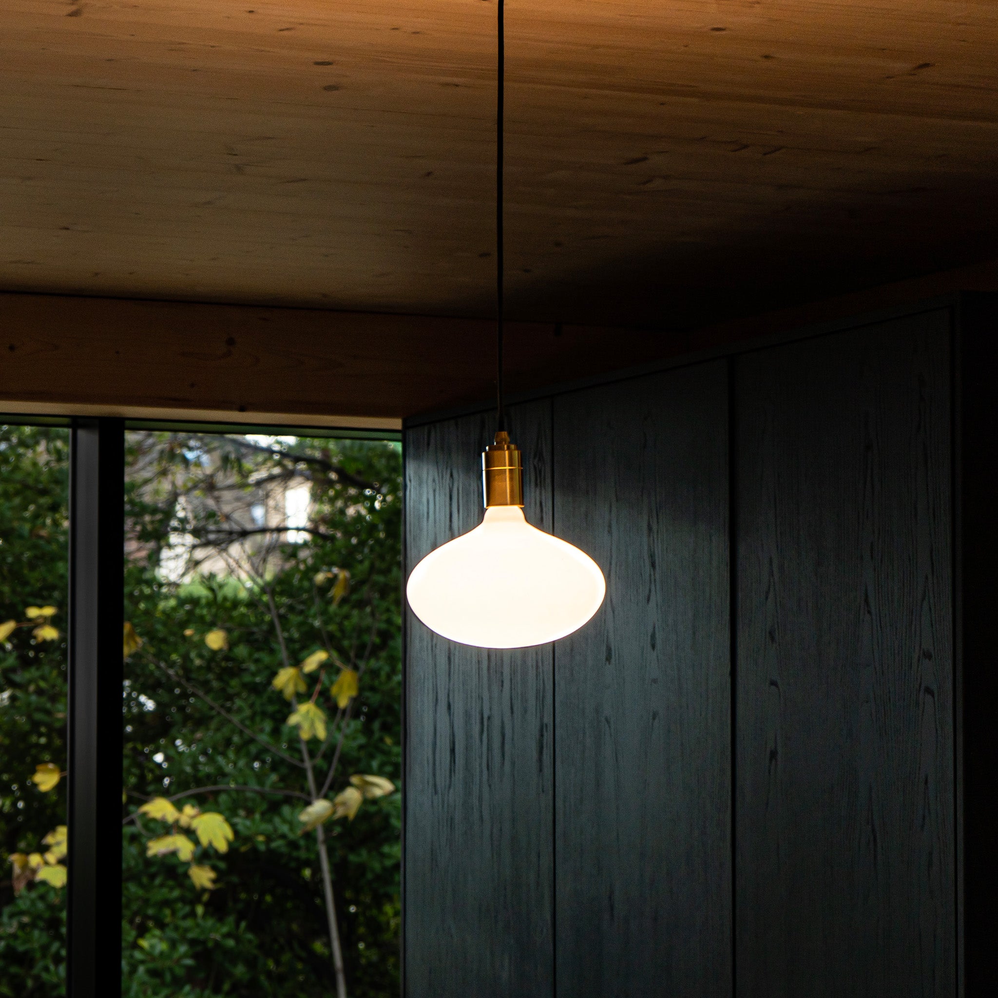 Tala Oval II Plug-In Pendant in Brass in a styled interior setting (view 2)