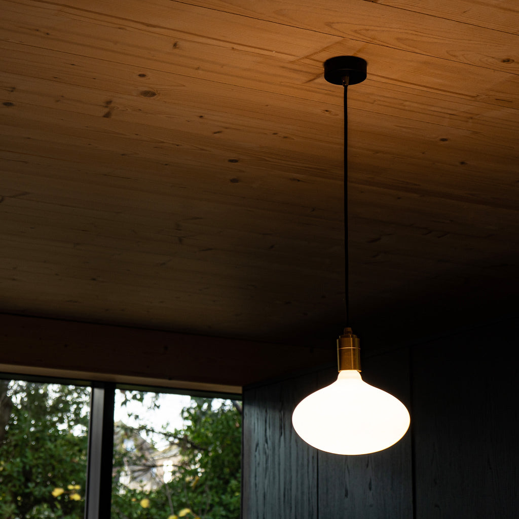 Tala Oval II Pendant Light in Graphite in a styled interior setting (view 3)