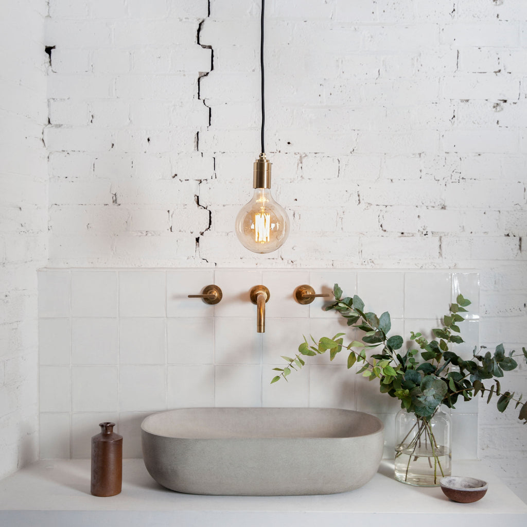 Tala Gaia Pendant Light in Brass in a styled interior setting