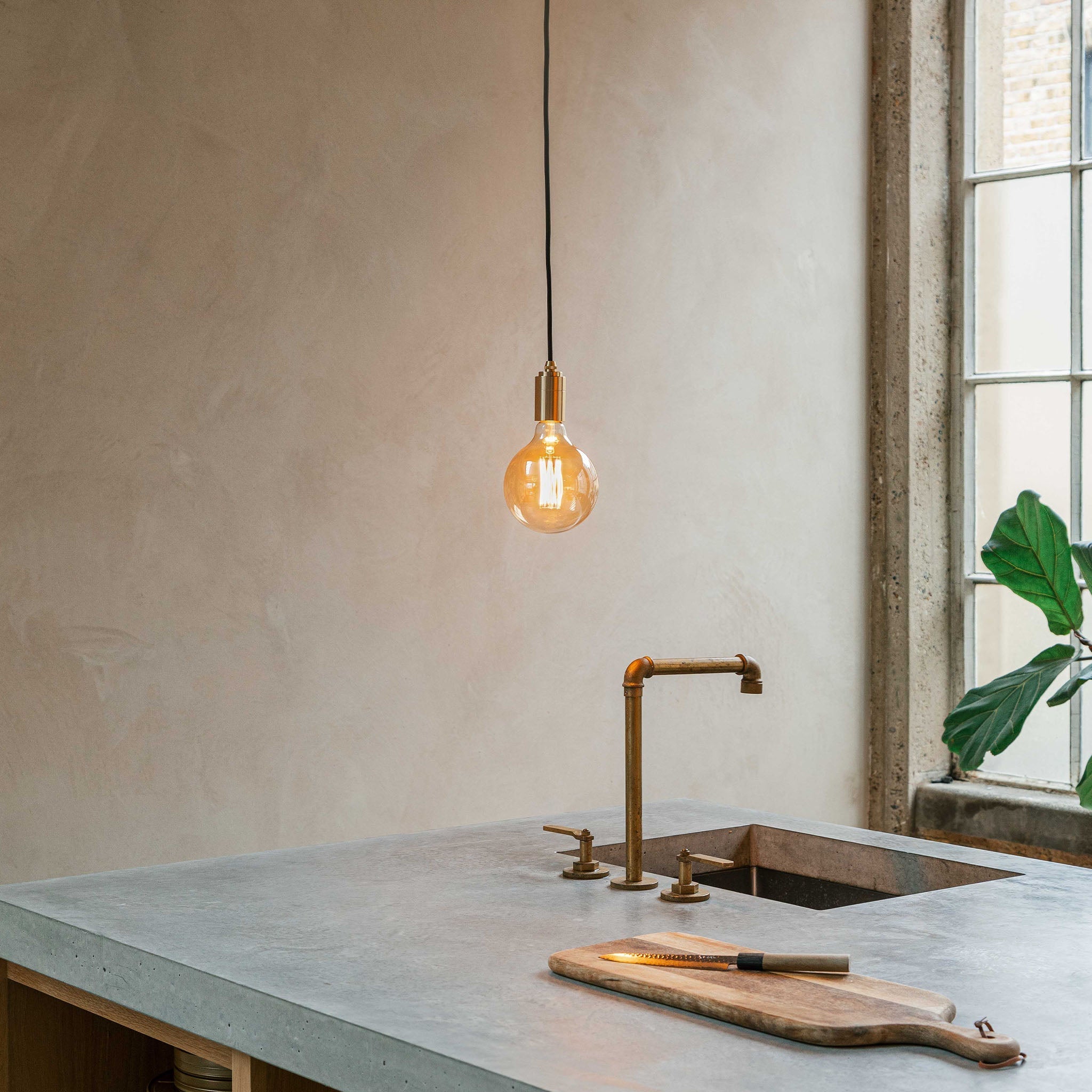 Tala Gaia Pendant Light in Brass in a styled interior setting (view 2)