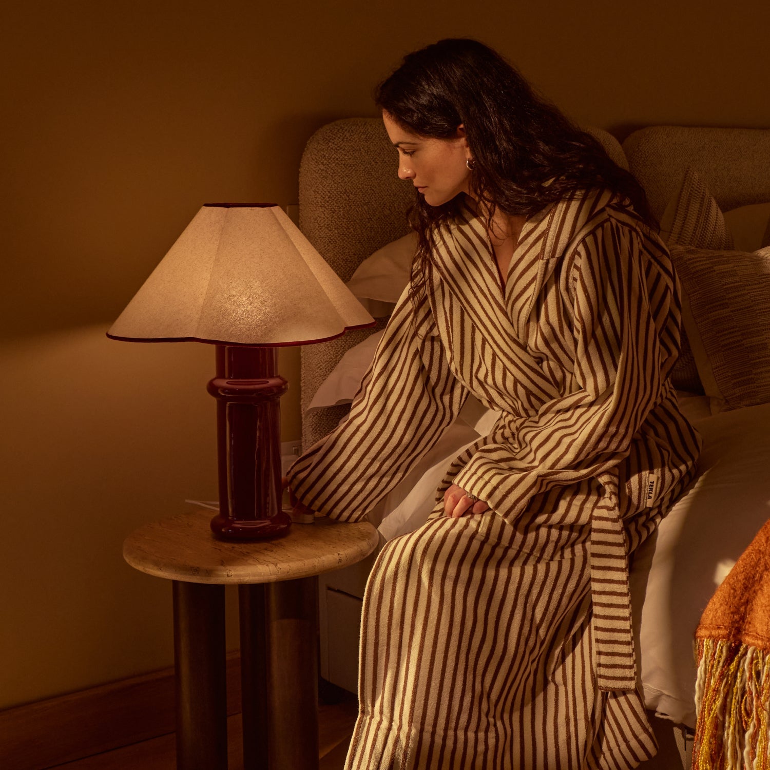 Tala Heath Table Lamp in Port Red in a styled interior setting