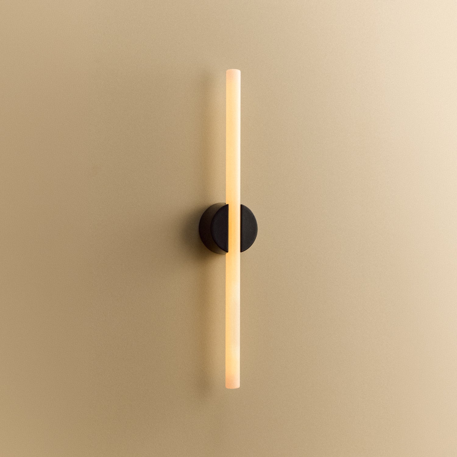 Tala Kilter 1.0 Wall Light in Dark Grey shown illuminated (view 2)