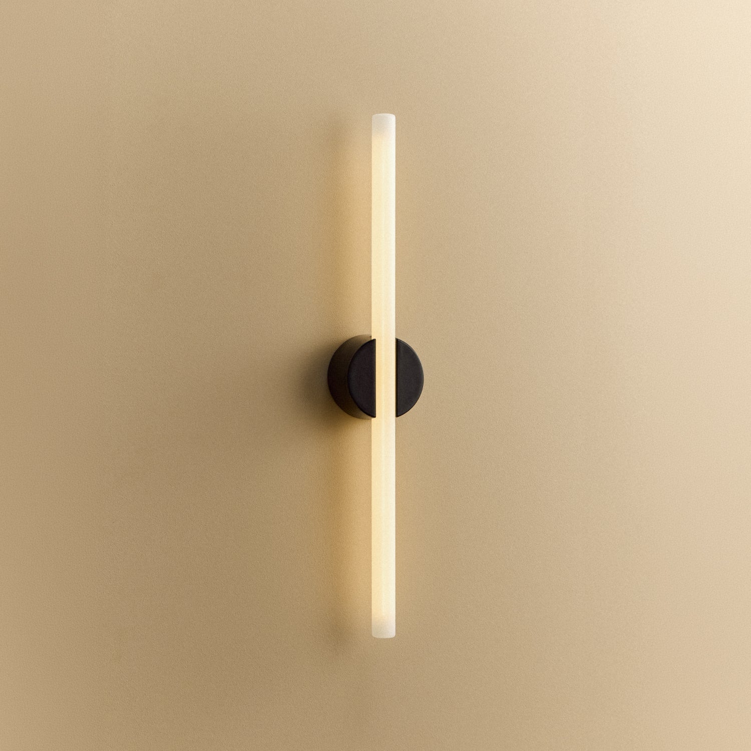 Tala Kilter 1.0 Wall Light in Dark Grey shown illuminated