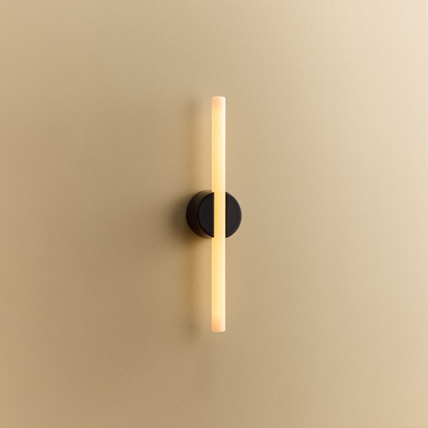 Tala Kilter 1.0 Wall Light in Dark Grey shown illuminated (view 3)
