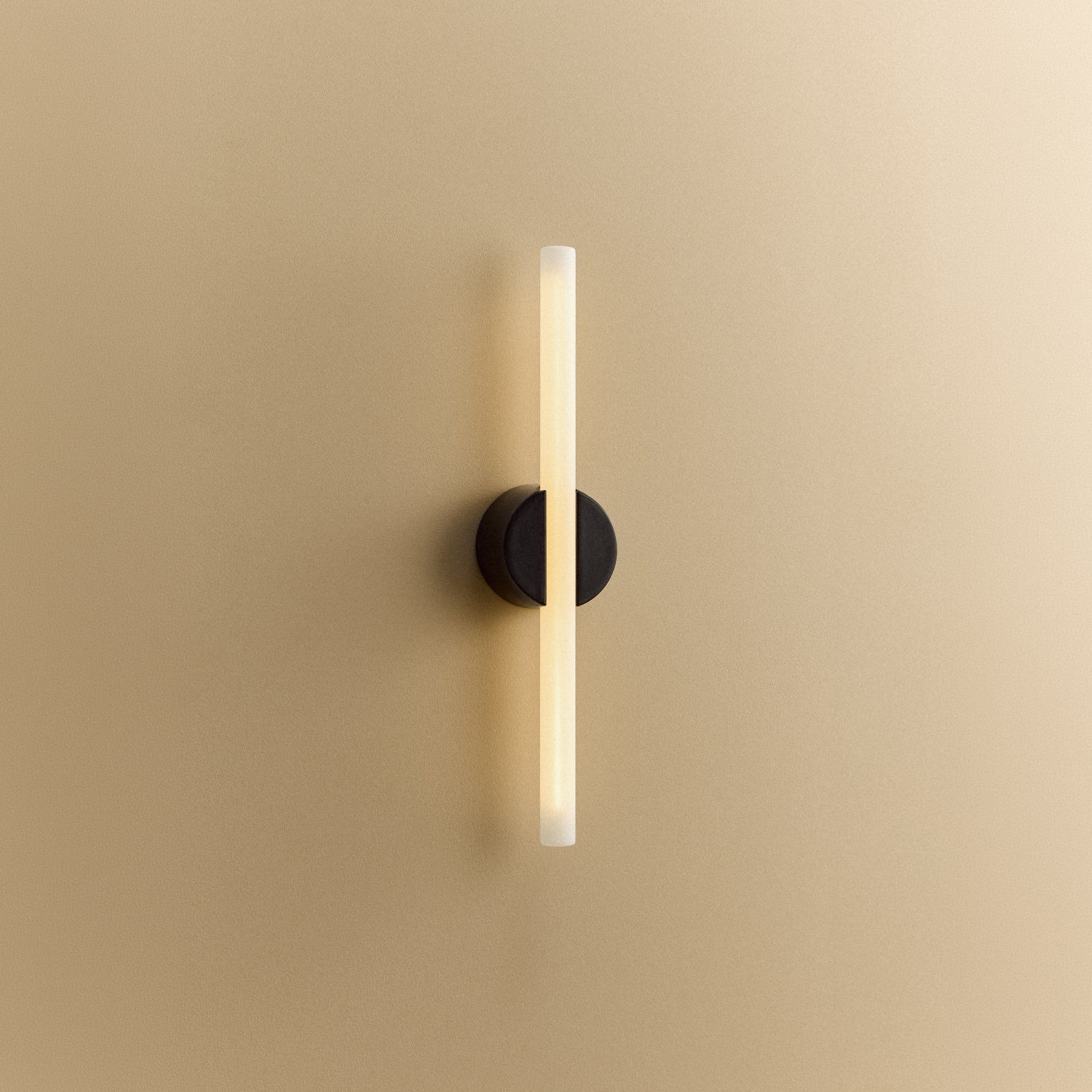 Tala Kilter 1.0 Wall Light in Dark Grey shown illuminated (view 4)
