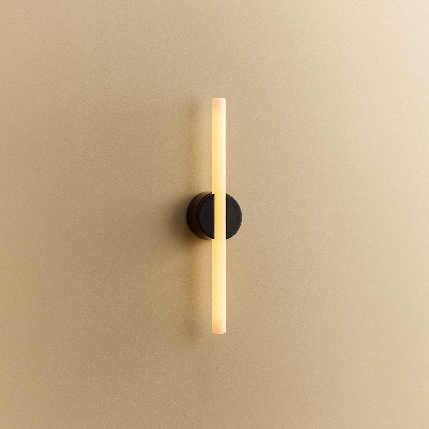 Tala Kilter 2.0 Wall Light in Dark Grey shown illuminated (view 3)