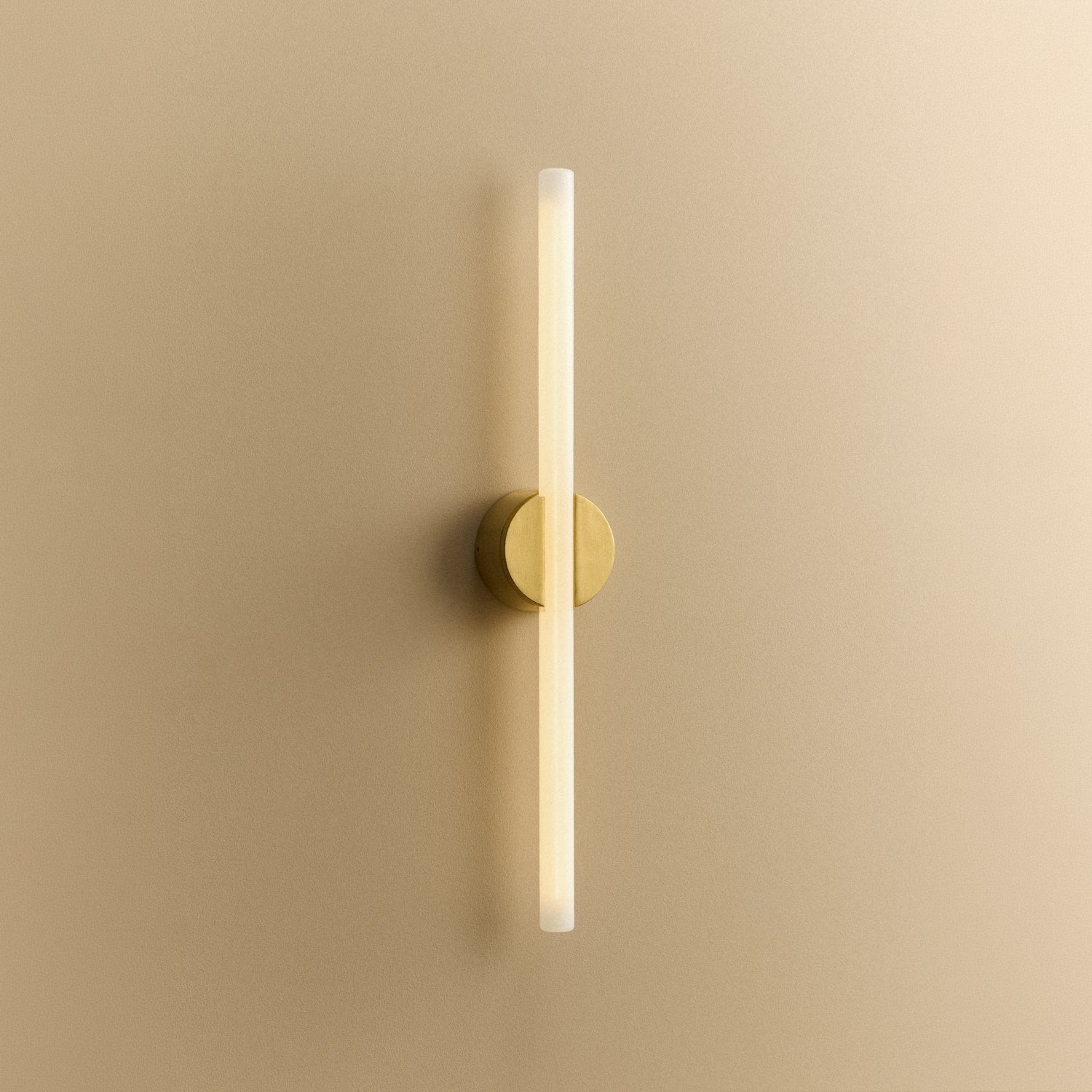 Tala Kilter 2.0 Wall Light in Brushed Brass shown illuminated (view 2)