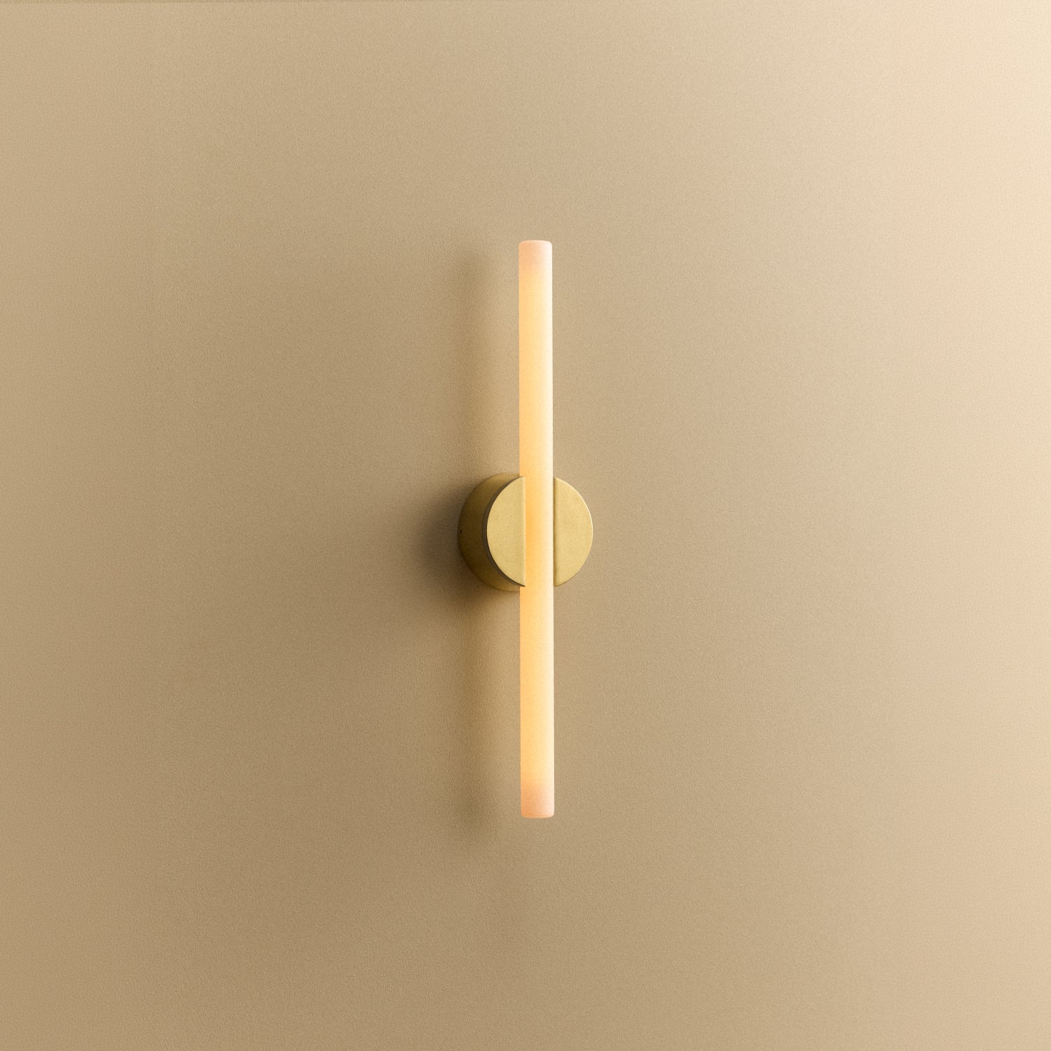 Tala Kilter 2.0 Wall Light in Brushed Brass shown illuminated (view 3)