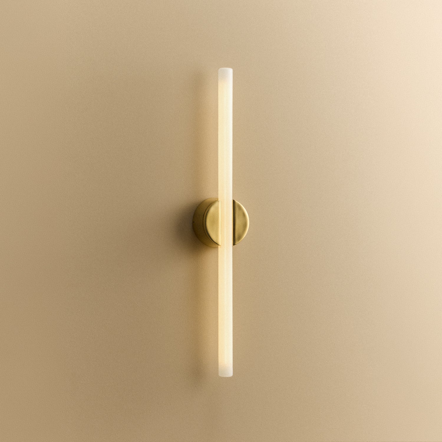 Tala Kilter 2.0 Wall Light in Polished Brass shown illuminated (view 2)