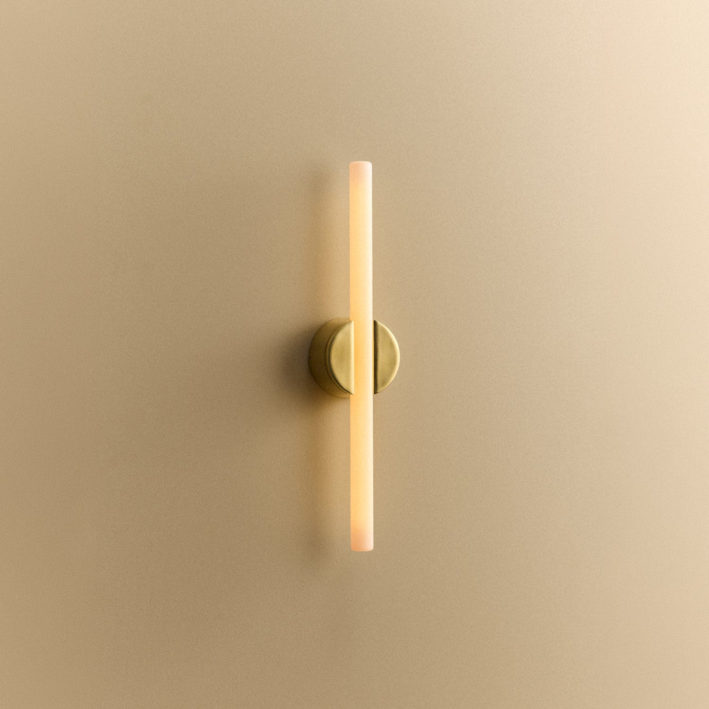 Tala Kilter 2.0 Wall Light in Polished Brass shown illuminated (view 3)