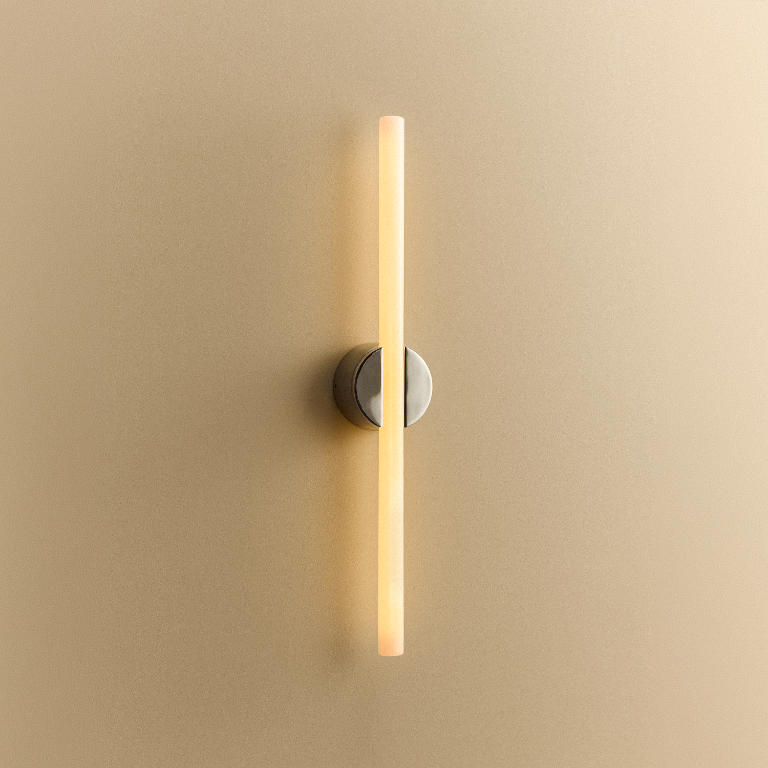 Tala Kilter 2.0 Wall Light in Polished Stainless Steel shown illuminated
