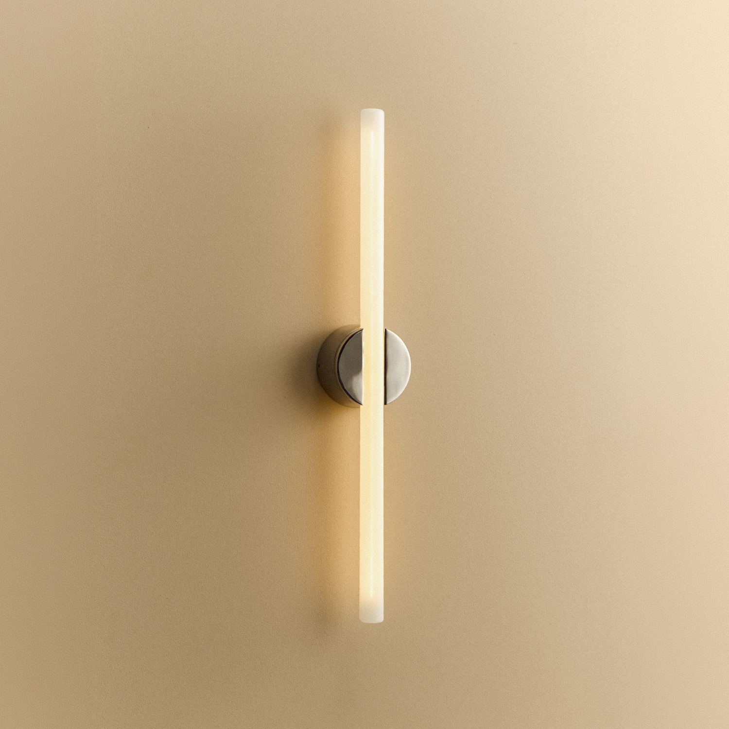 Tala Kilter 2.0 Wall Light in Polished Stainless Steel shown illuminated (view 2)
