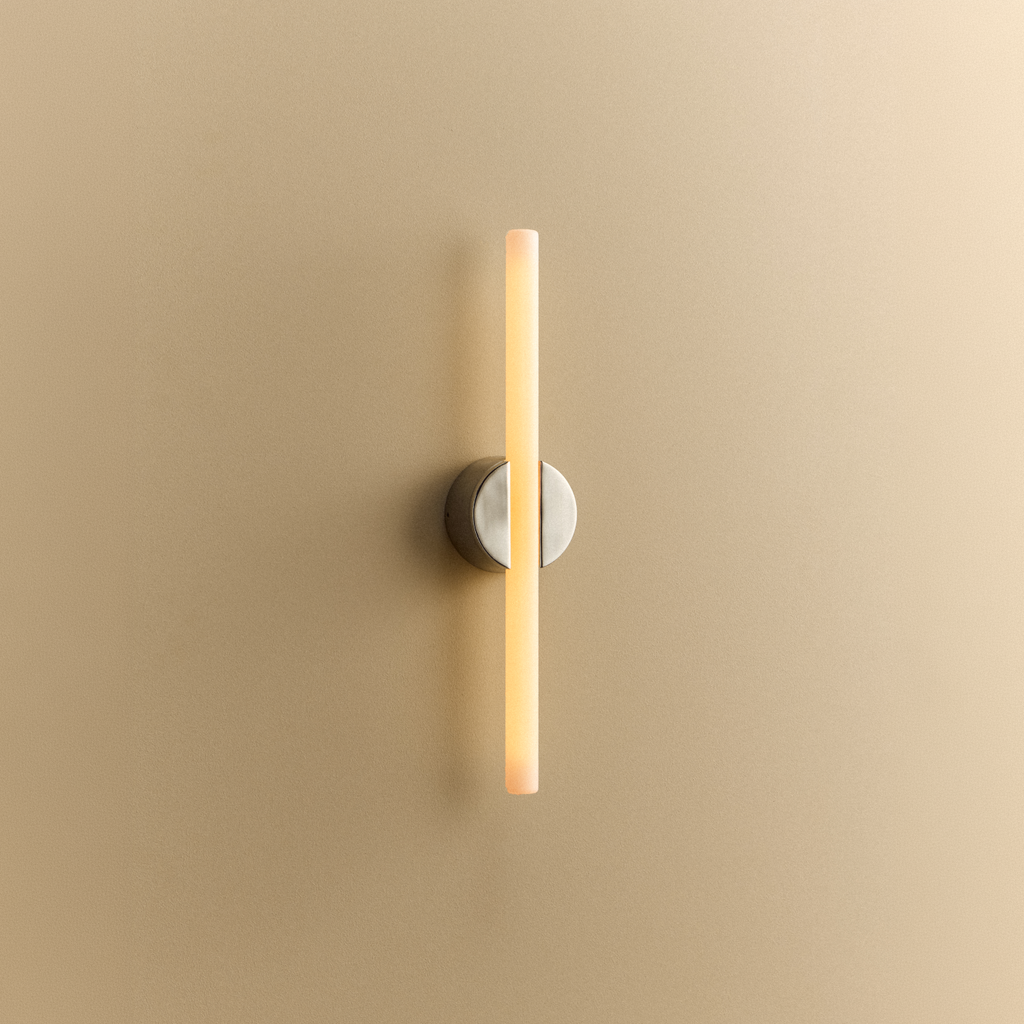 Tala Kilter 2.0 Wall Light in Polished Stainless Steel shown illuminated (view 3)