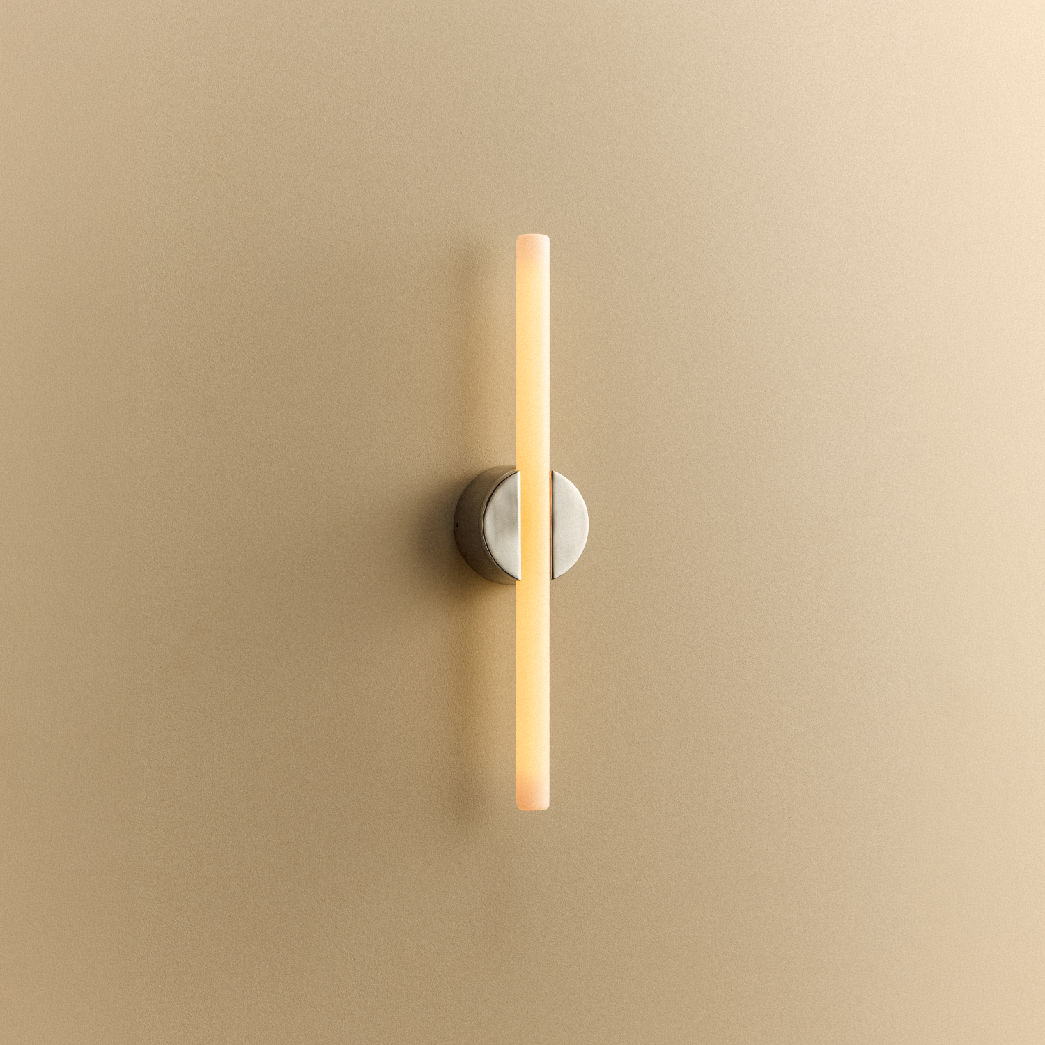 Tala Kilter 2.0 Wall Light in Polished Stainless Steel shown illuminated (view 3)