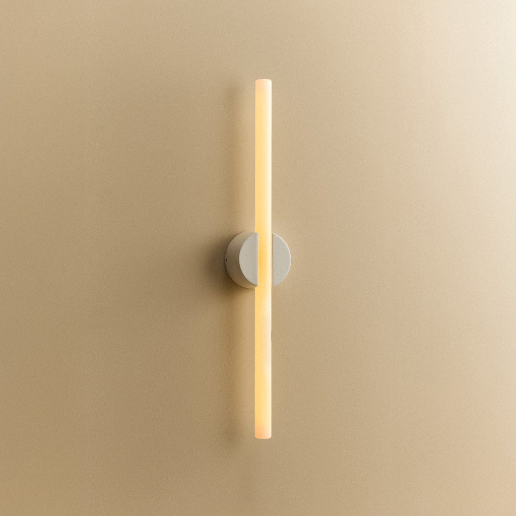 Tala Kilter 1.0 Wall Light in White shown illuminated (view 2)