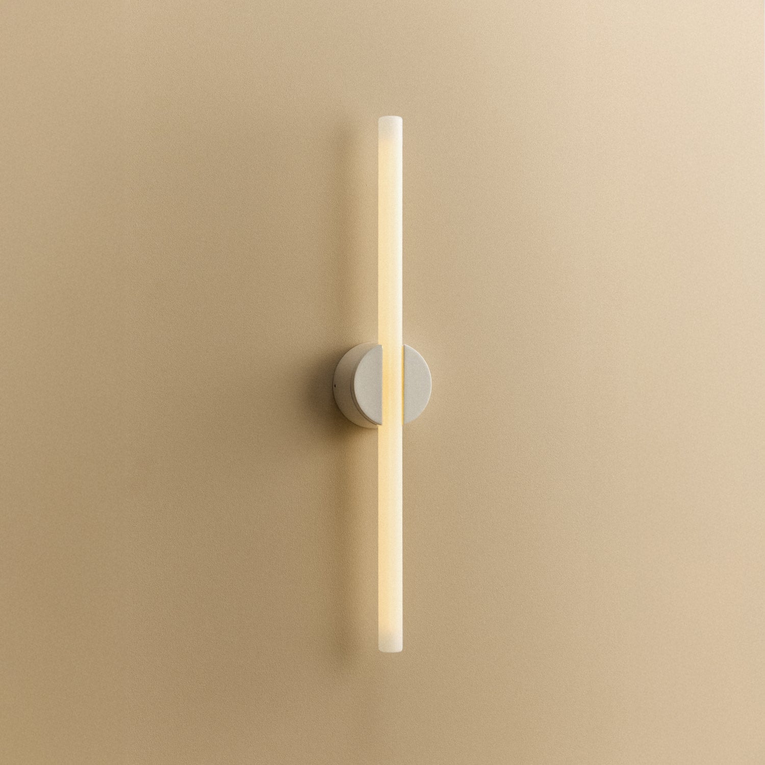 Tala Kilter 2.0 Wall Light in White shown illuminated (view 2)