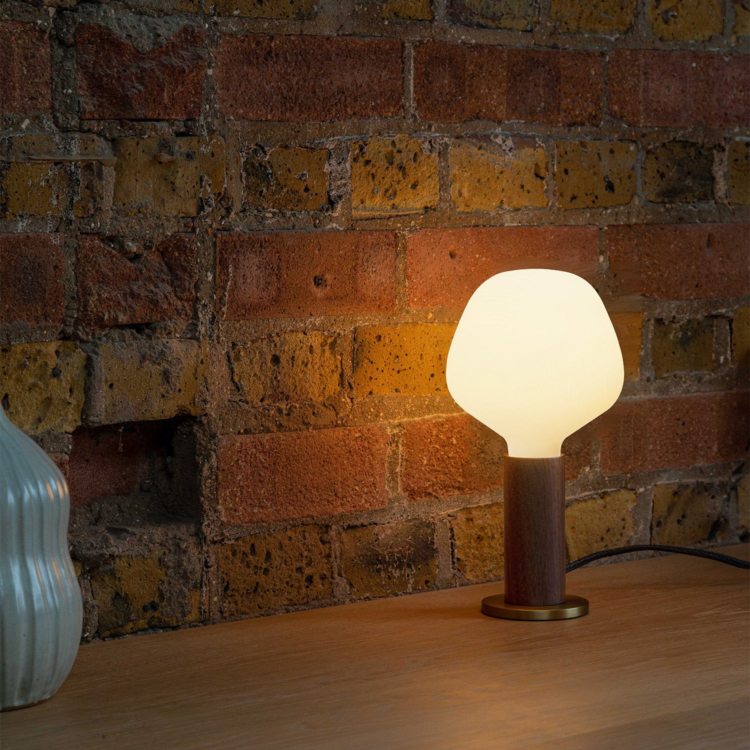 Tala Knuckle Table Lamp in Walnut + Enno in a styled interior setting
