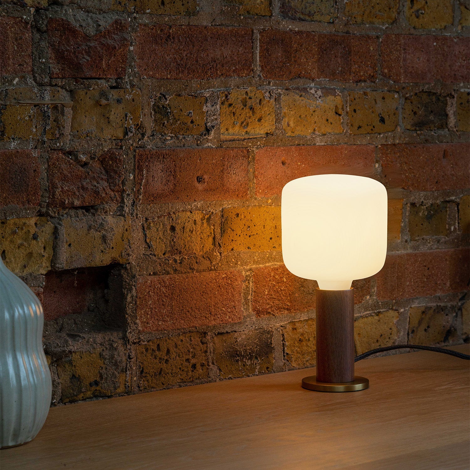 Tala Knuckle Table Lamp in Walnut + Oblo in a styled interior setting