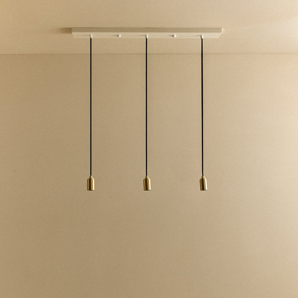 Tala Linear Triple Pendant in Brass fixture shown without a bulb