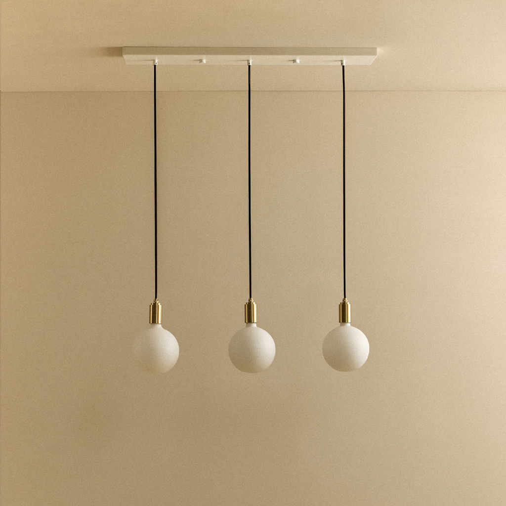Tala Linear Triple Pendant in Brass + Sphere IV shown unlit