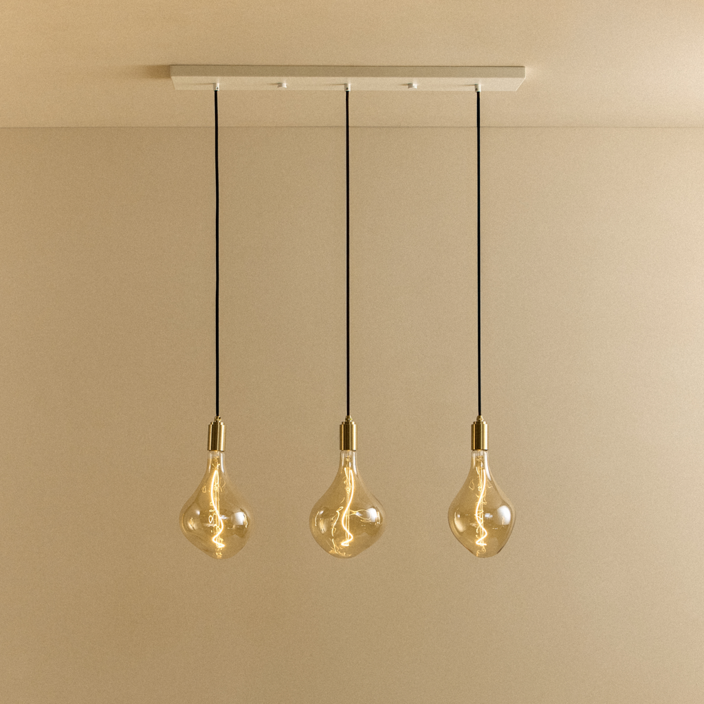 Tala Linear Triple Pendant in Brass + Voronoi II shown illuminated