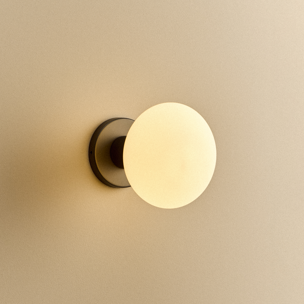 Tala Lochan Wall Light in Graphite + Oval Dim to Warm shown illuminated