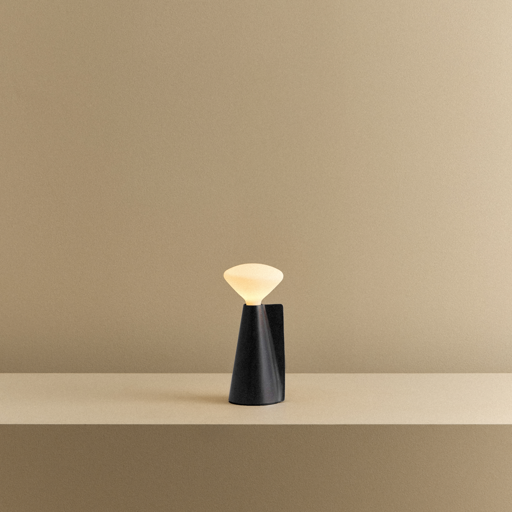 Tala Mantle Portable Lamp in Granite Black shown illuminated