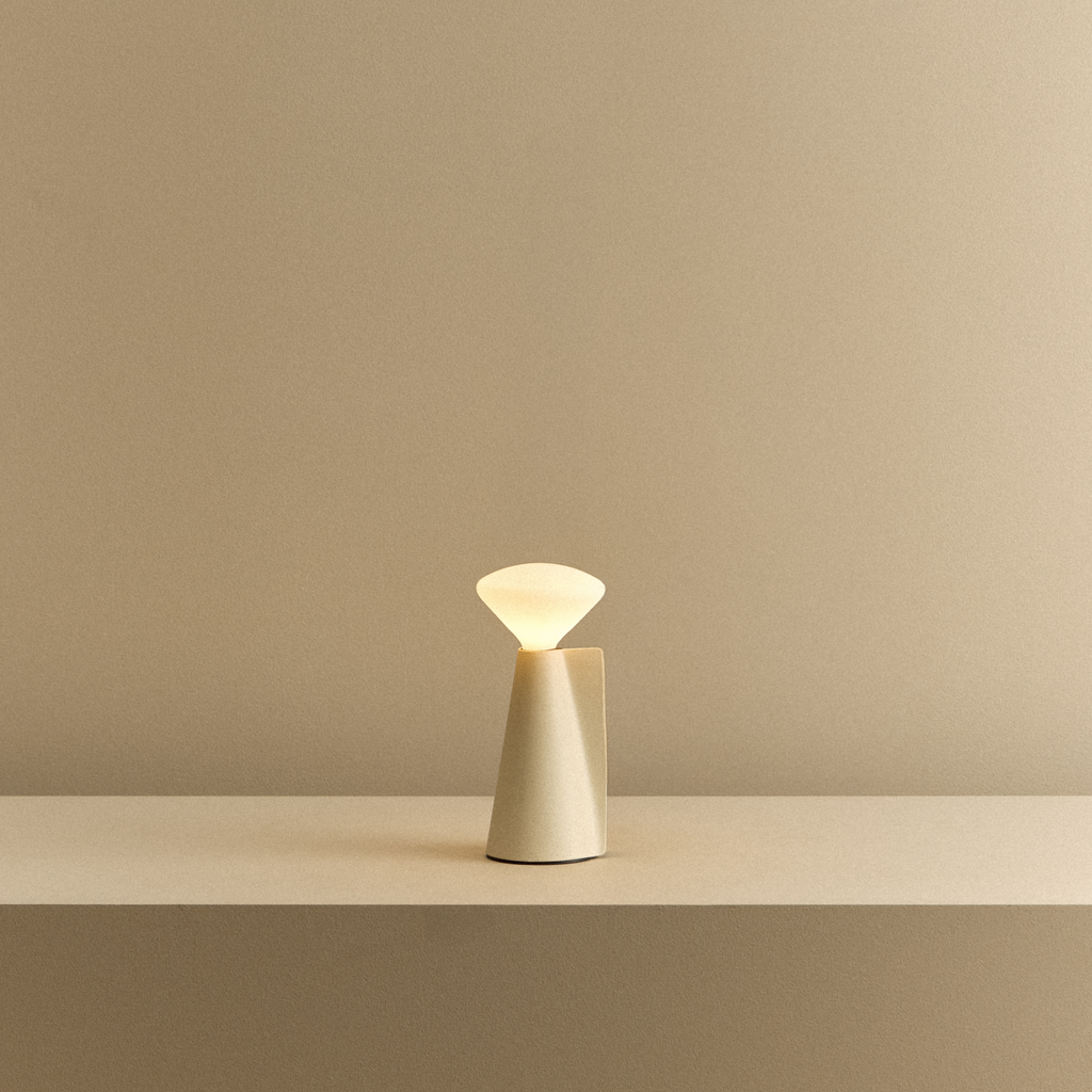 Tala Mantle Portable Lamp in Stone White shown illuminated