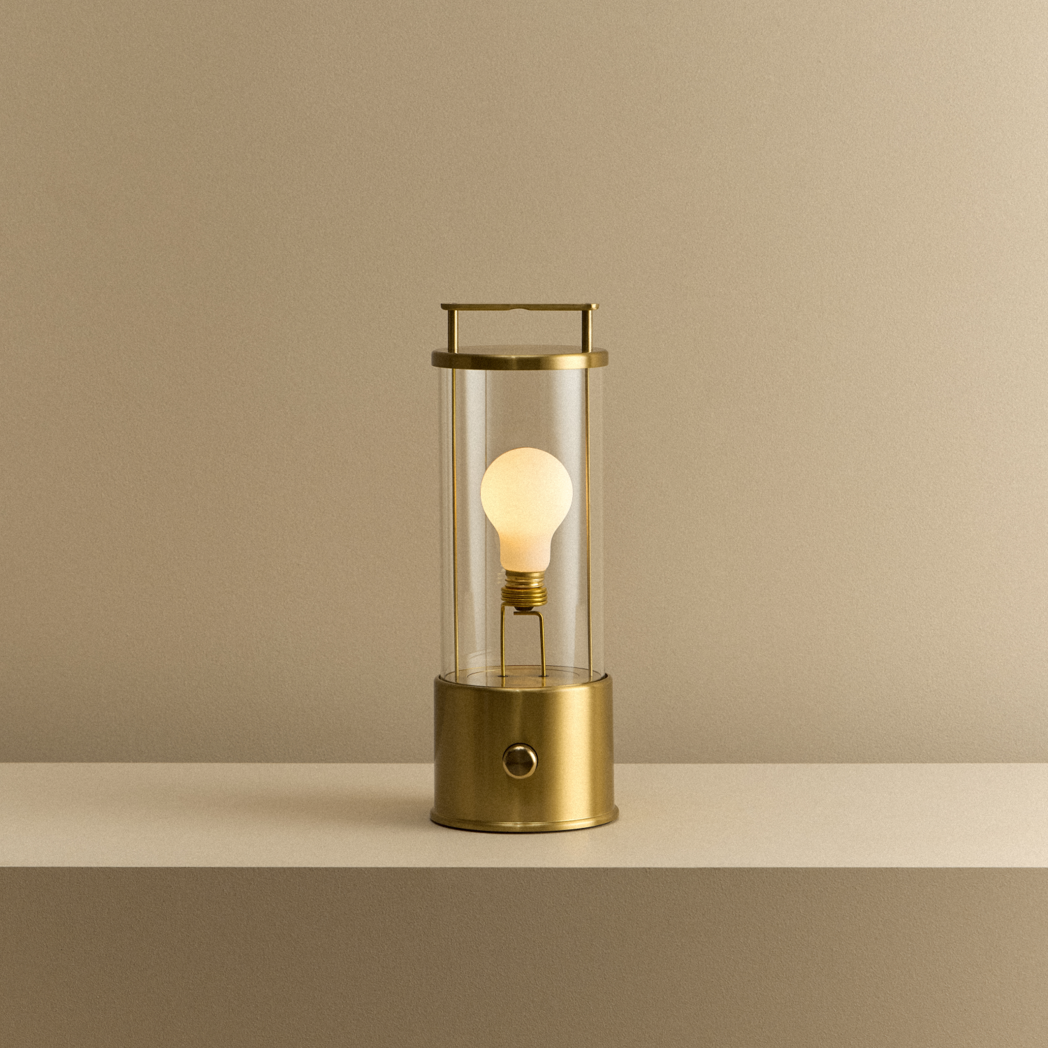Tala The Muse 1.0 Portable Lamp in Solid Brass shown illuminated