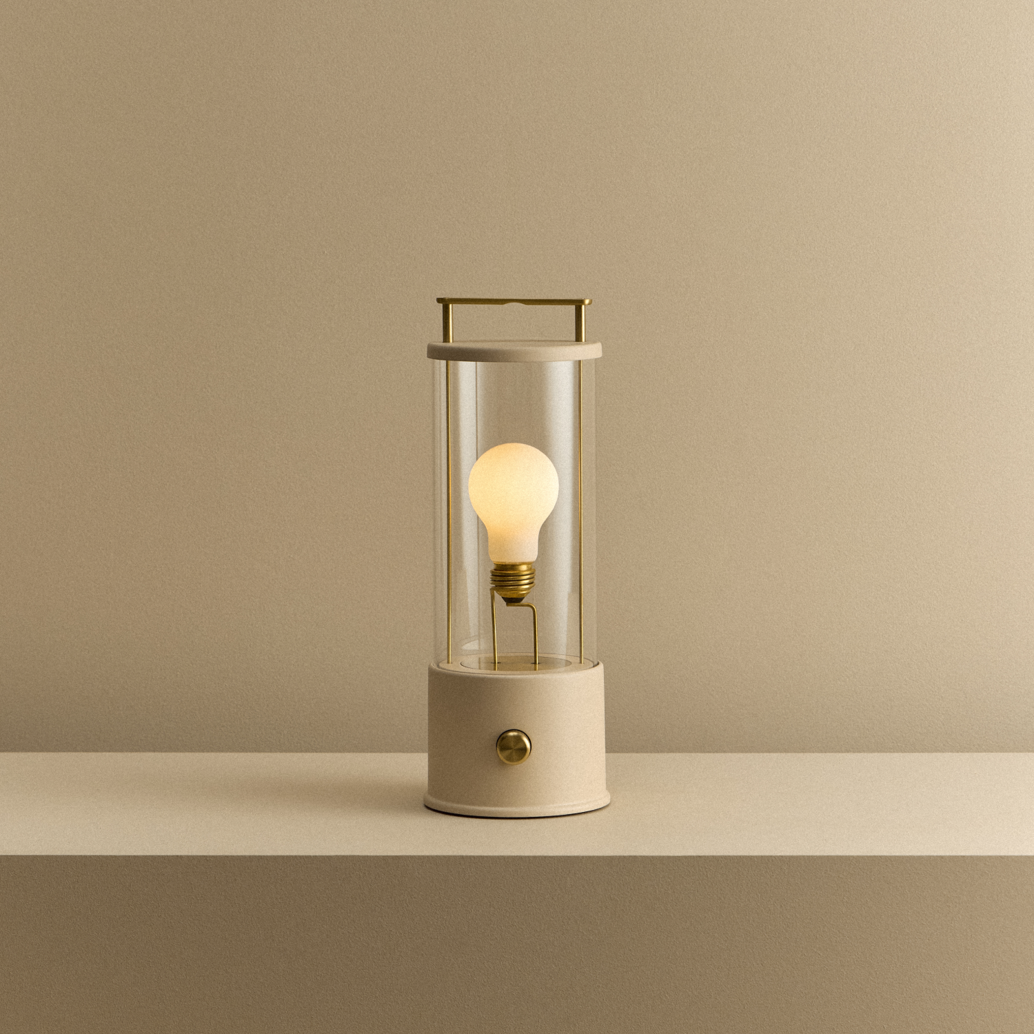 Tala The Muse 1.0 Portable Lamp in Setting Plaster Pink shown illuminated