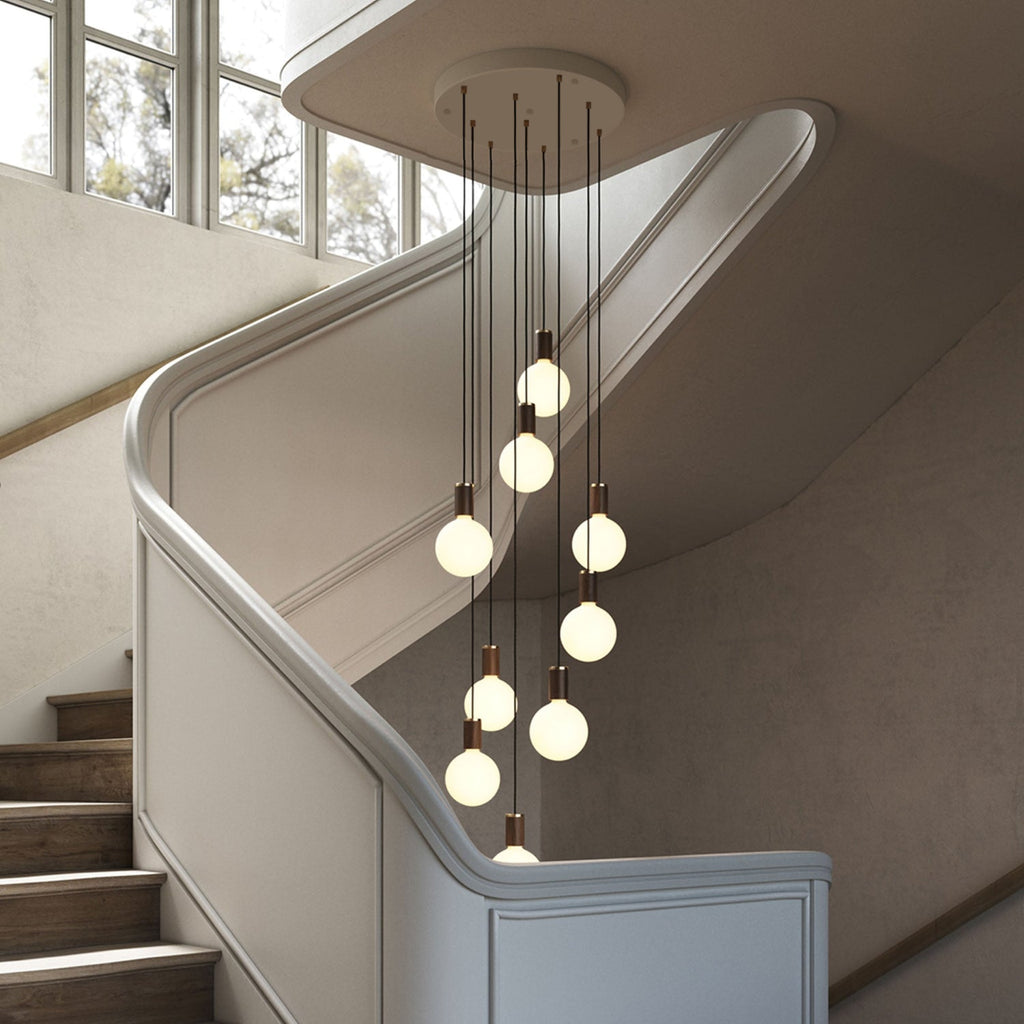 Tala Nine Pendant in Walnut + Sphere IV in a styled interior setting
