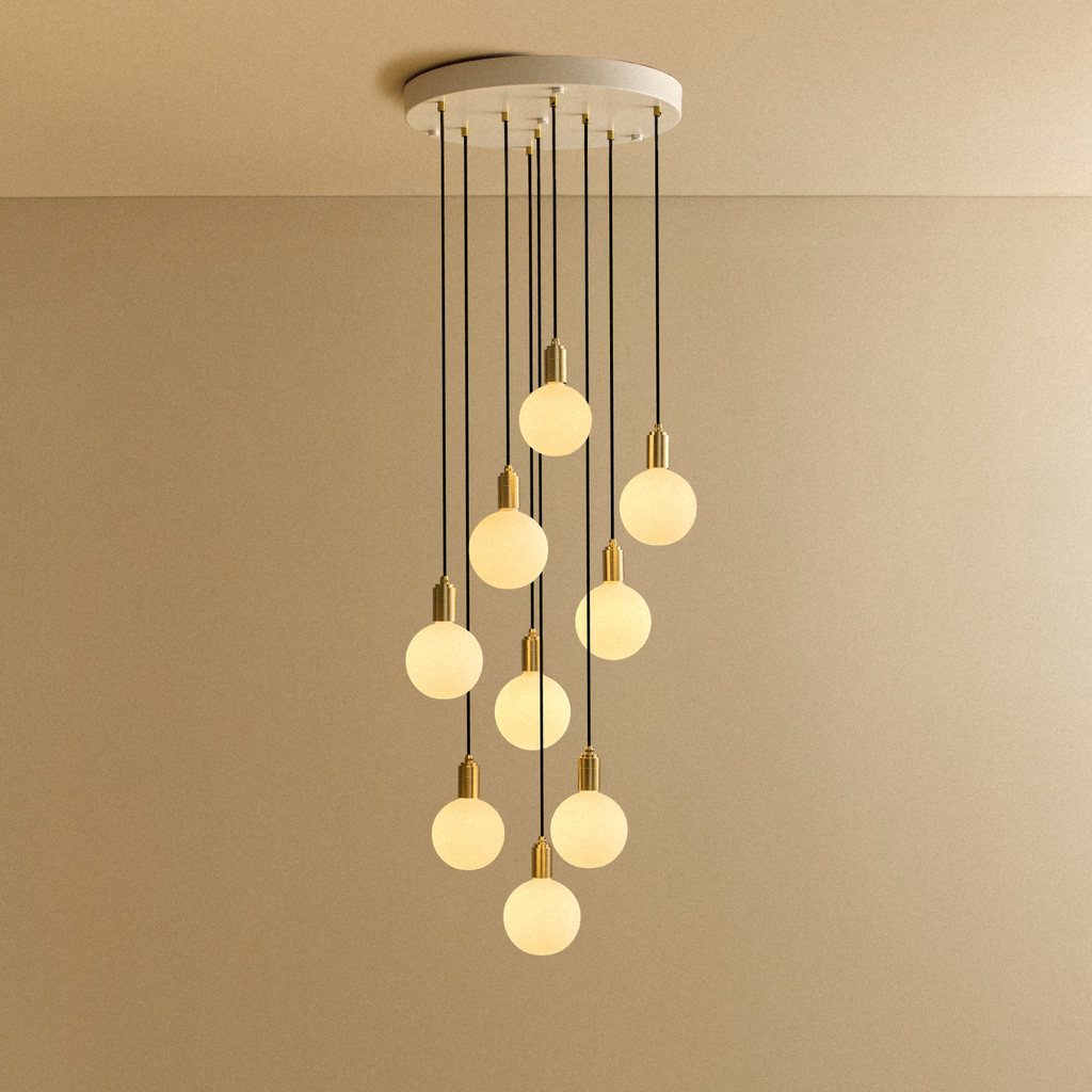 Tala Nine Pendant in Brass + Sphere IV shown illuminated